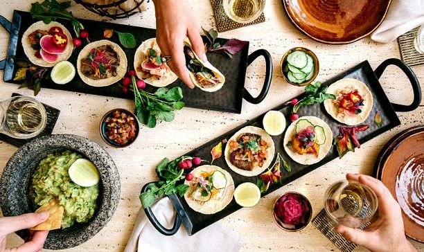 Table spread with small plates and drinks